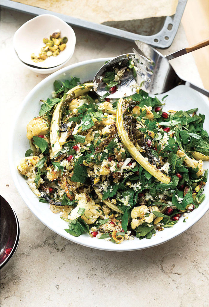 You can purchase pomegranate seeds or remove them from fruit yourself for this cauliflower, pomegranate and pistachio salad. (Photography by Jonathan Lovekin)
