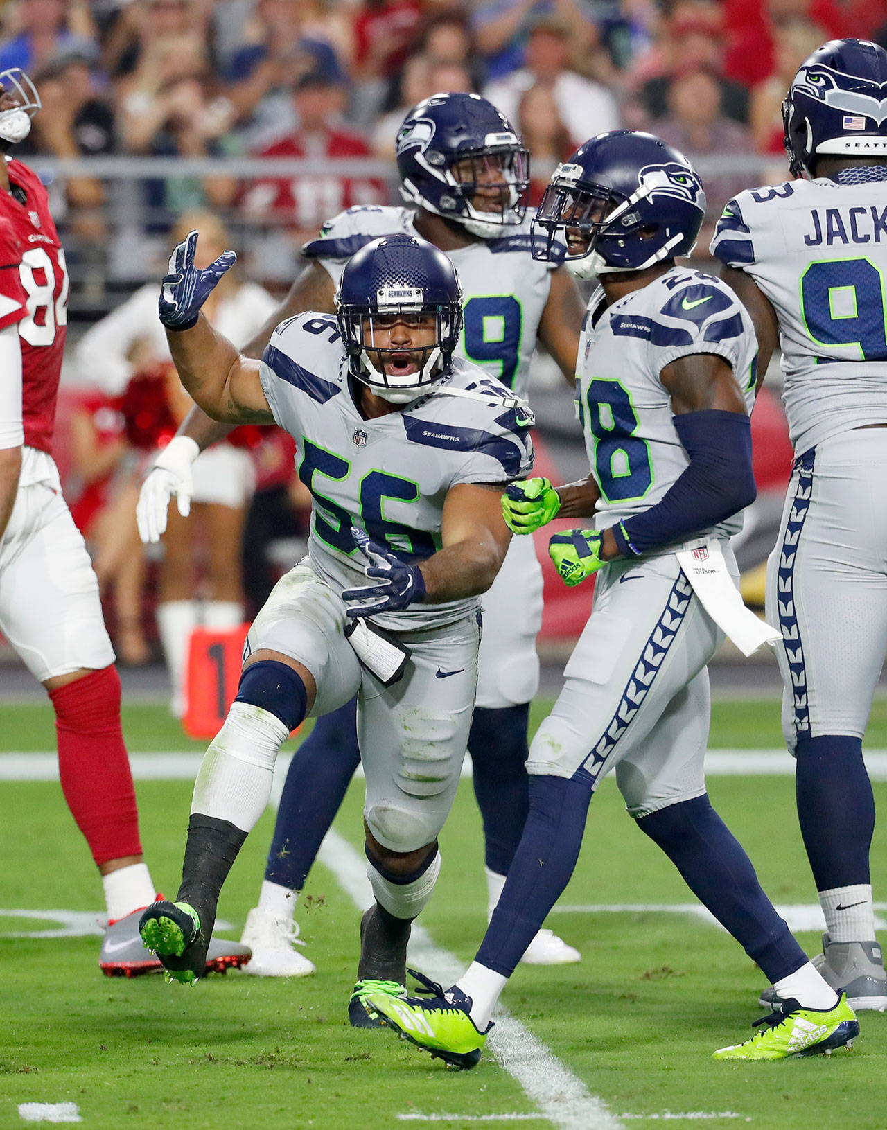 Seahawks linebacker Mychal Kendricks (56) celebrates during Seattle’s game against the Arizona Cardinals on Sept. 30. The game was the last of three Kendricks played with the Seahawks before being suspended by the NFL. (AP Photo/Rick Scuteri)