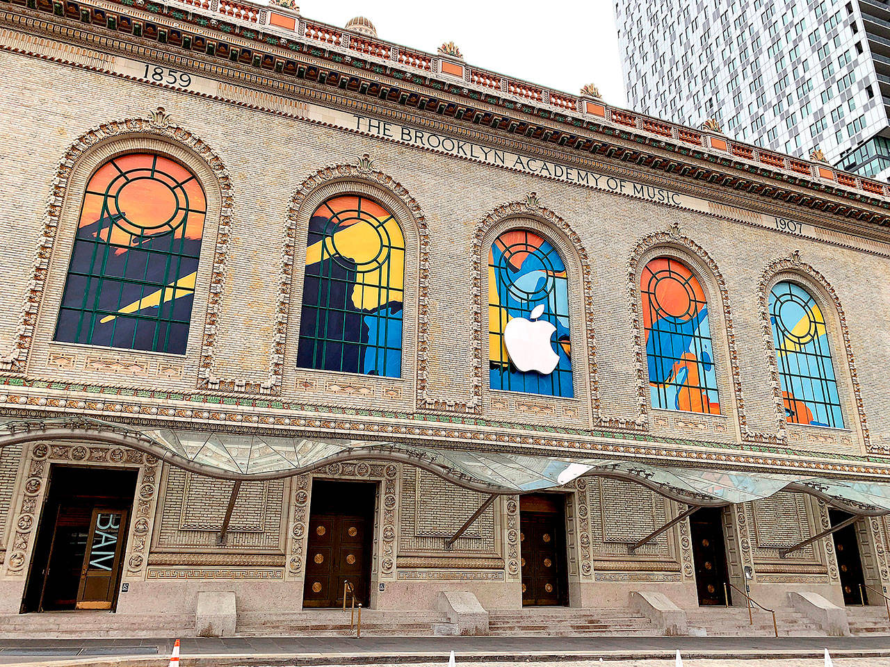 BLOOMBERG                                Apple signage adorns the Brooklyn Academy of Music in New York, where the technology giant unveiled redesigns of the MacBook Air and iPad tablet.