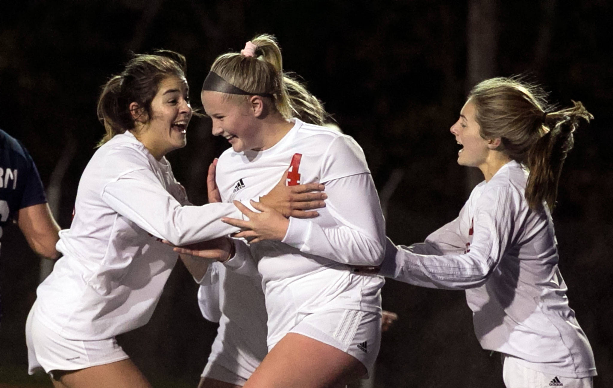 Snohomish’s Taylor Khorrami (left) and Jody Miller (right) celebrate a goal from Delaney Kaysner (center) during a 3A Northwest District 1 Tournament game against Squalicum on Oct. 30, 2018, at Shoreline Stadium. (Kevin Clark / The Herald)