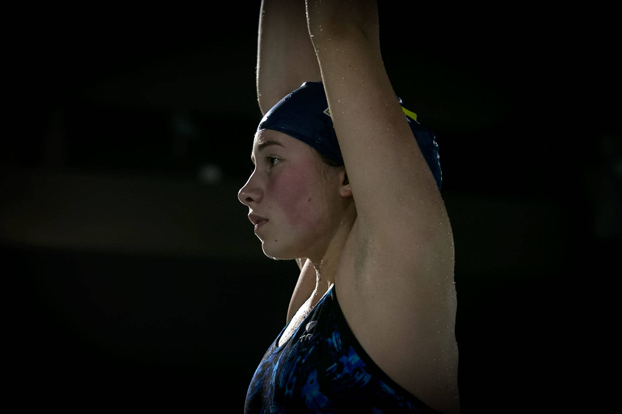 Hailey Faith of Everett High School and three-time state competitor prepares for a dive at Forest Park Swim Center in Everett on October 17, 2018. (Kevin Clark / The Herald)