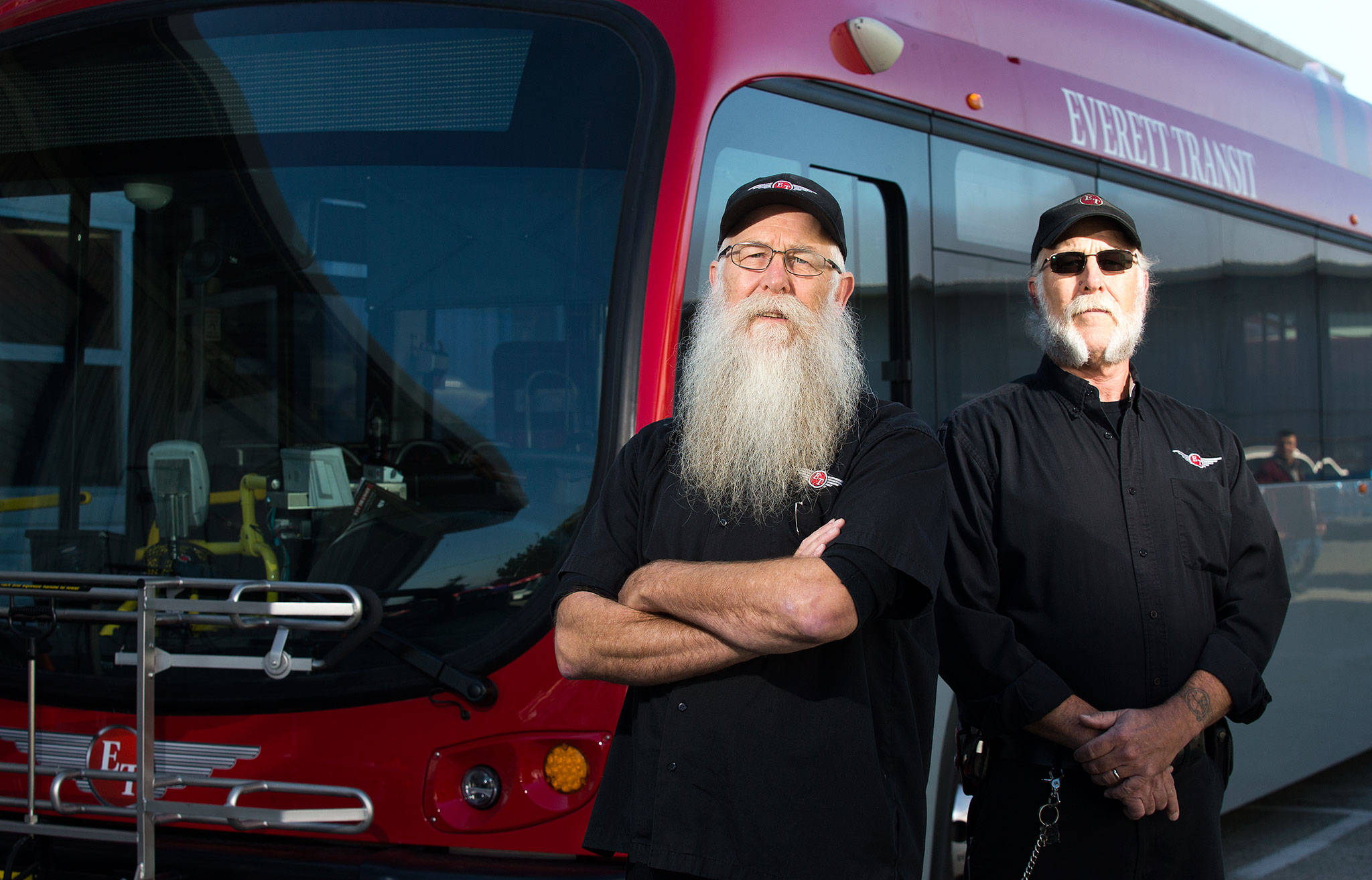 Twins Garry and Larry Westvang both have driven for Everett Transit since the early 1980s. Garry has 38 years behind the wheel and Larry has 36 years. (Andy Bronson / The Herald)