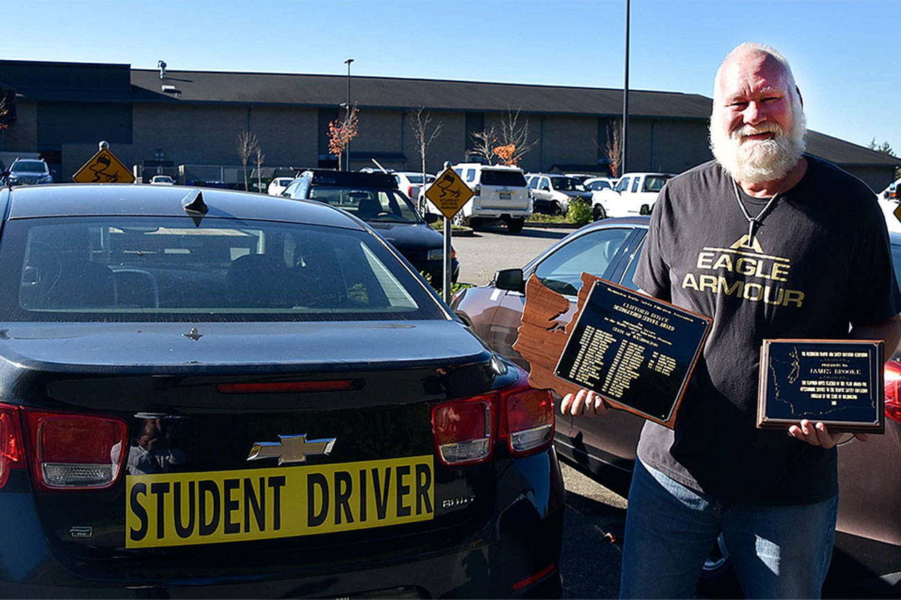 His job in Arlington is teaching teenagers how to drive