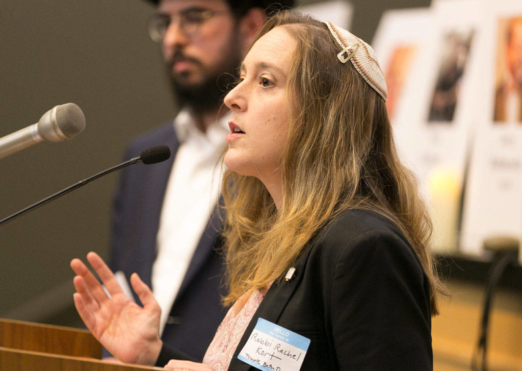 Rabbi Rachel Kort makes her address during the interfaith candlelight vigil Thursday night. (Kevin Clark / The Herald)
