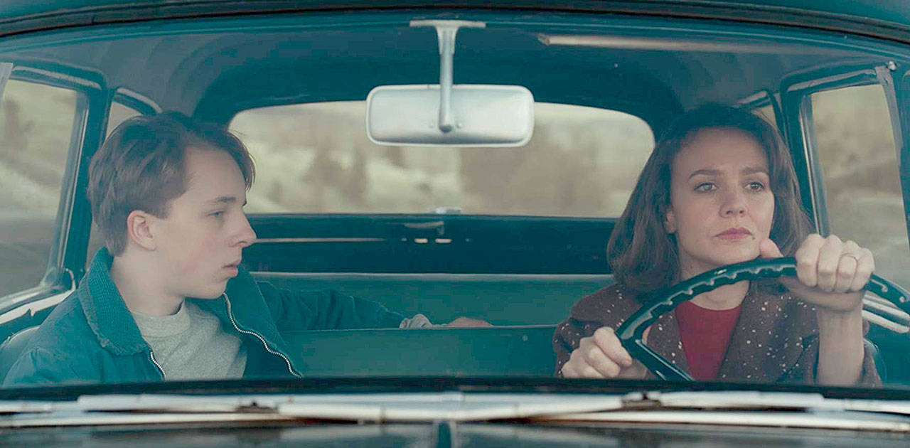 Carey Mulligan plays a frustrated housewife in 1960 and Ed Oxenbould is her teenage son in “Wildlife.” (IFC Films)