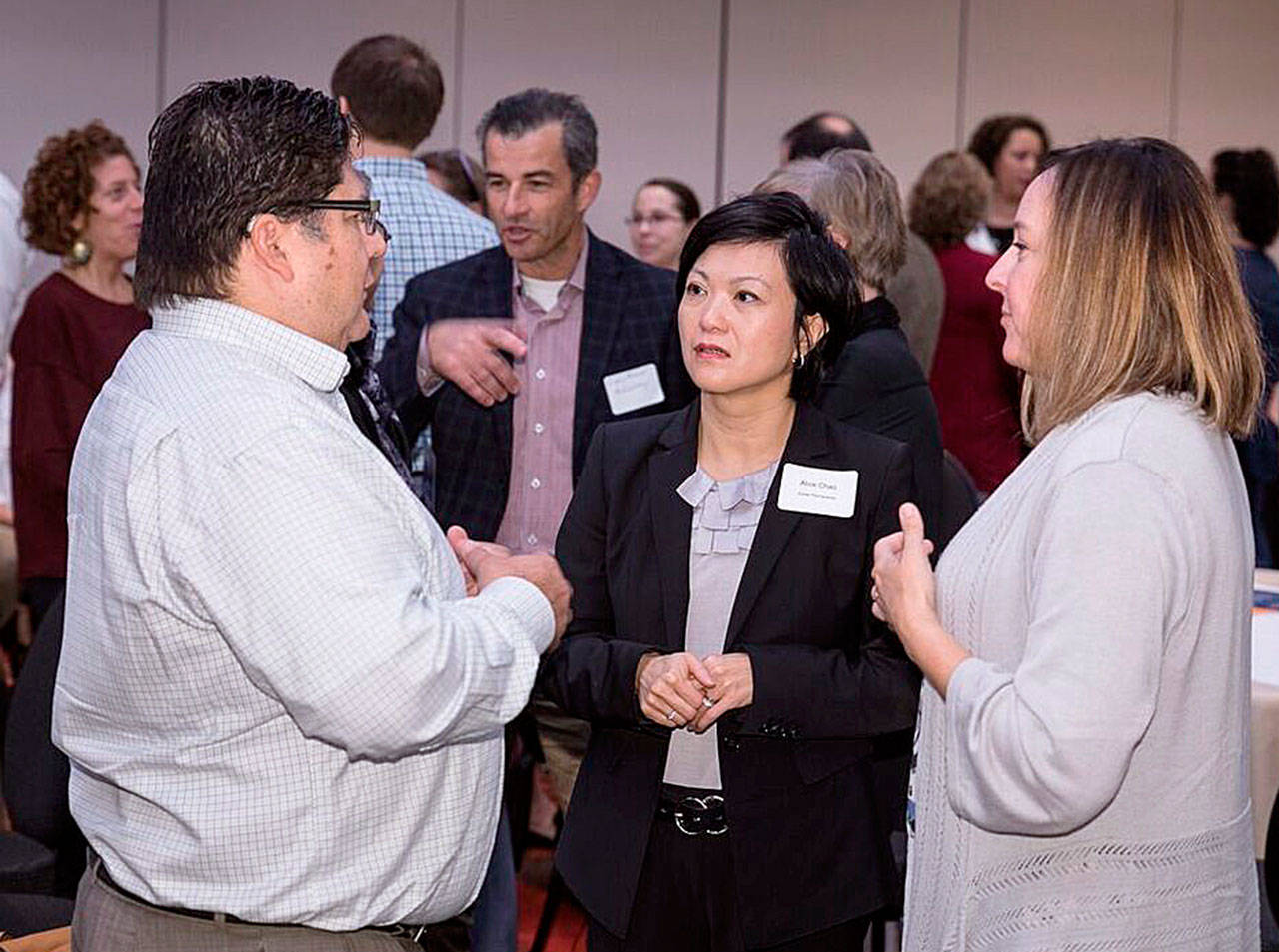Community Transit’s Martin Munguia (left) and Kaiser Permanente’s Alice Chao (center) and the Community Foundation’s Karri Matau share thoughts. (William Wright)