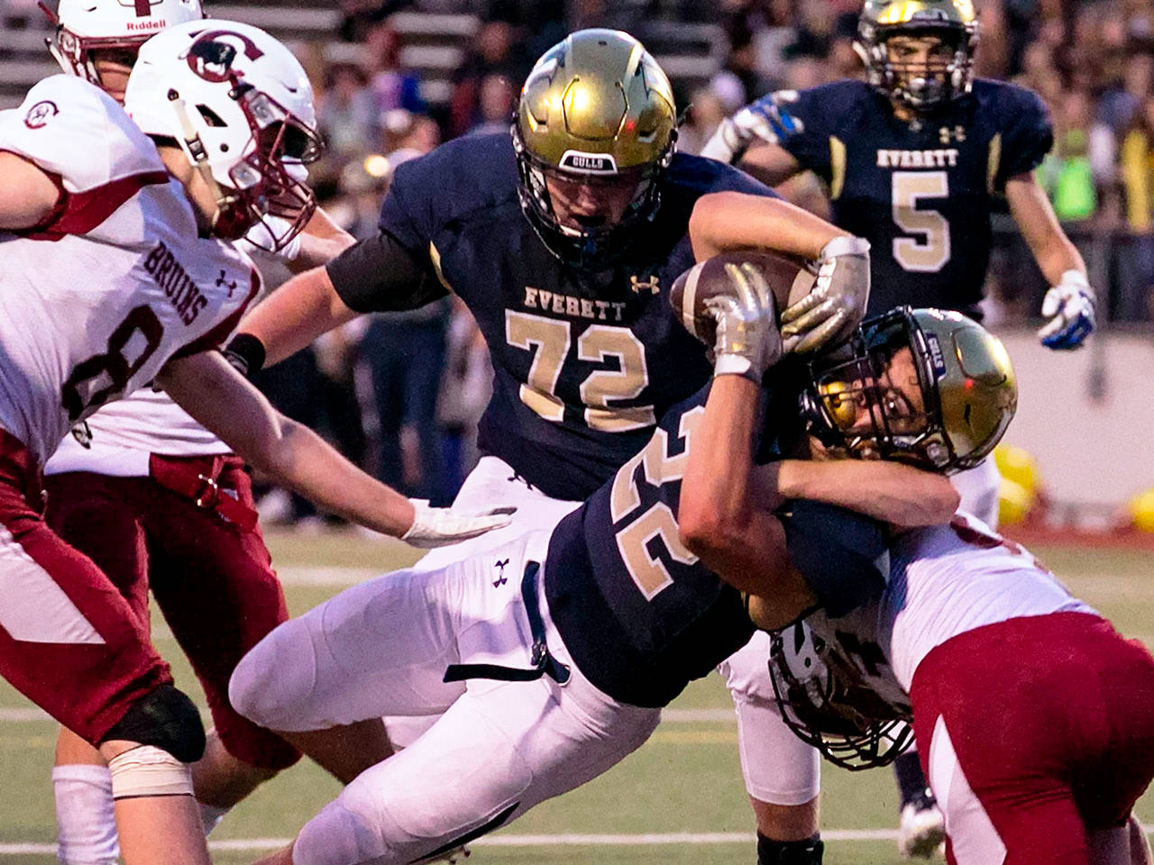 Everett’s Christian Balmer scores a touchdown during an Aug. 31 game in Everett. (Kevin Clark / The Herald)