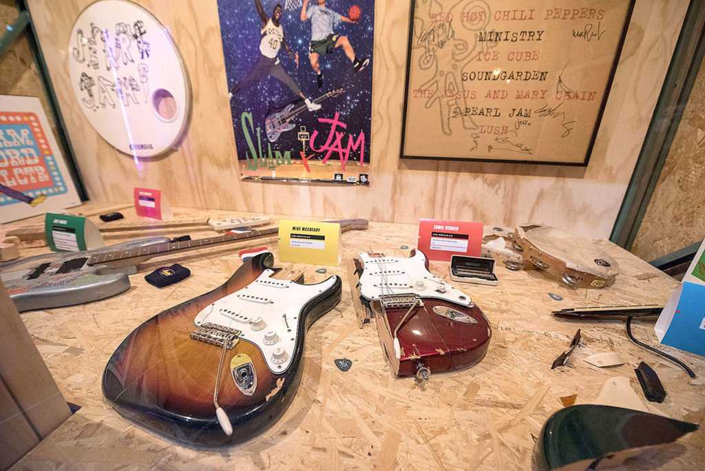 A display of instruments destroyed by Jeff Ament, Mike McCready, Stone Gossard and Eddie Vedder. (Jim Bennett/MoPOP)
