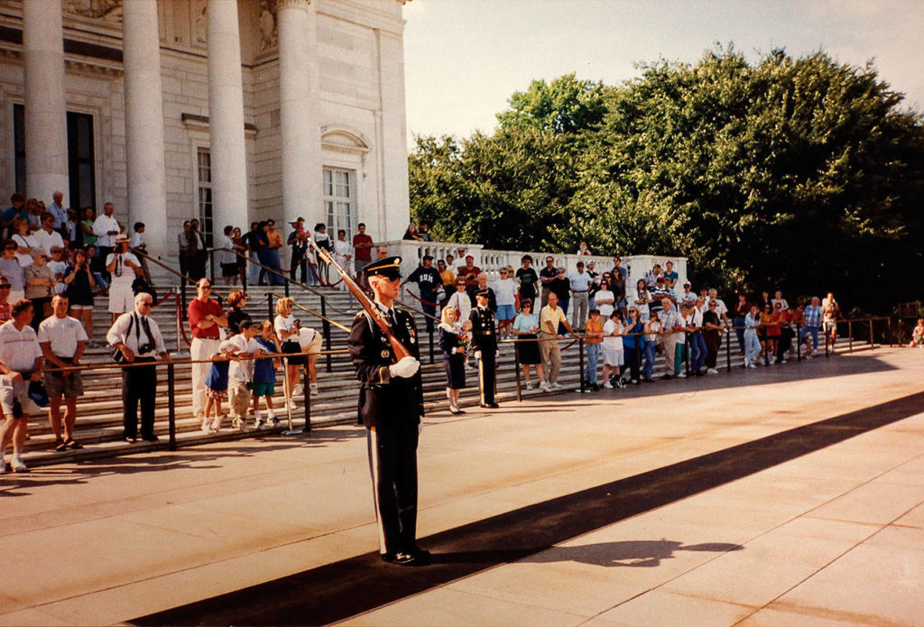 With a crowd looking on from the steps of the Memorial Amphitheater, Tomb Guard Jason Biermann faces the Tomb of the Unknown Soldier. (Courtesy Jason Biermann)
