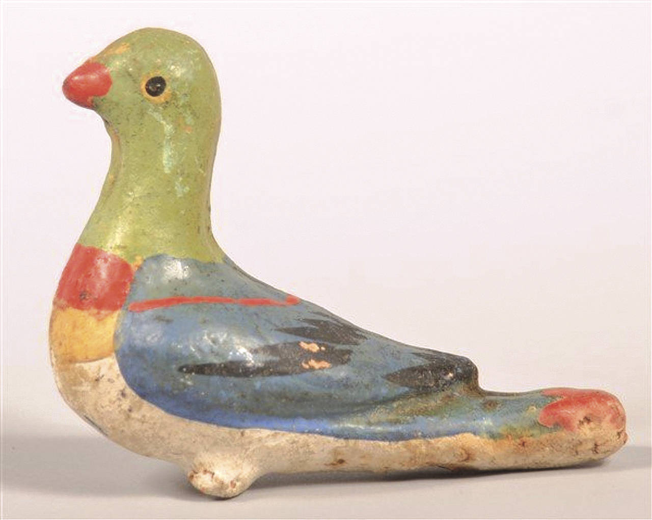 Bird whistles are still made, but of modern materials. This multicolored bird, a whistle that would whistle, sold for $212. (Cowles Syndicate Inc.)