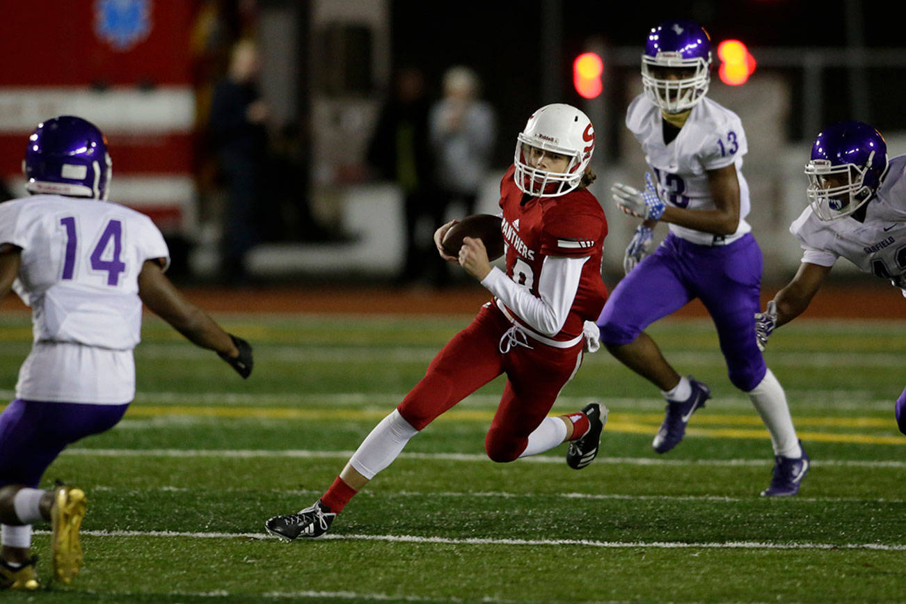 Snohomish’s Tayte Conover runs for a first down during Friday’s game in Snohomish. (Andy Bronson / The Herald)