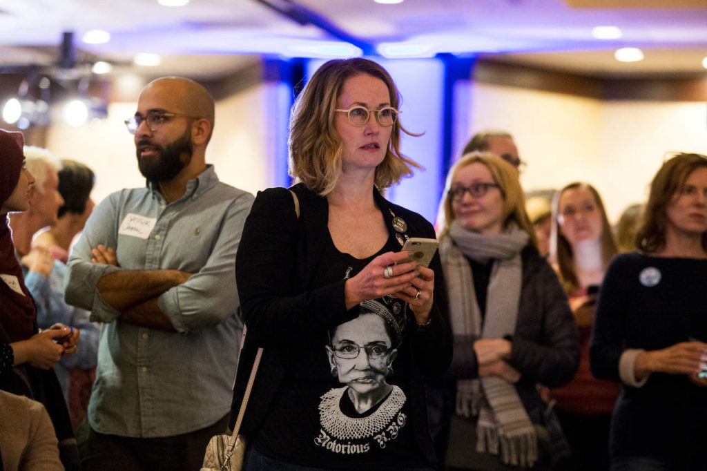 Laura Taylor sports a Notorious RBG shirt as she watches the election returns at the Washington State Democratic Party’s 2018 Election Night Watch Party at the Bellevue Hilton on Tuesday. (Andy Bronson / The Herald)
Laura Taylor watches the election returns at the Washington State Democratic Party’s election night party at the Bellevue Hilton on Tuesday. (Andy Bronson / The Herald) 
