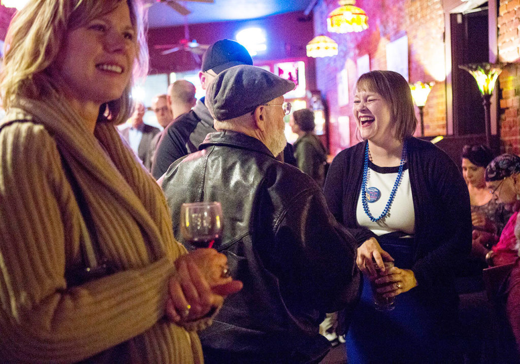 Everett City Council candidate Liz Vogeli chats with people at the Vintage Cafe during election night Tuesday in Everett. (Olivia Vanni / The Herald)
