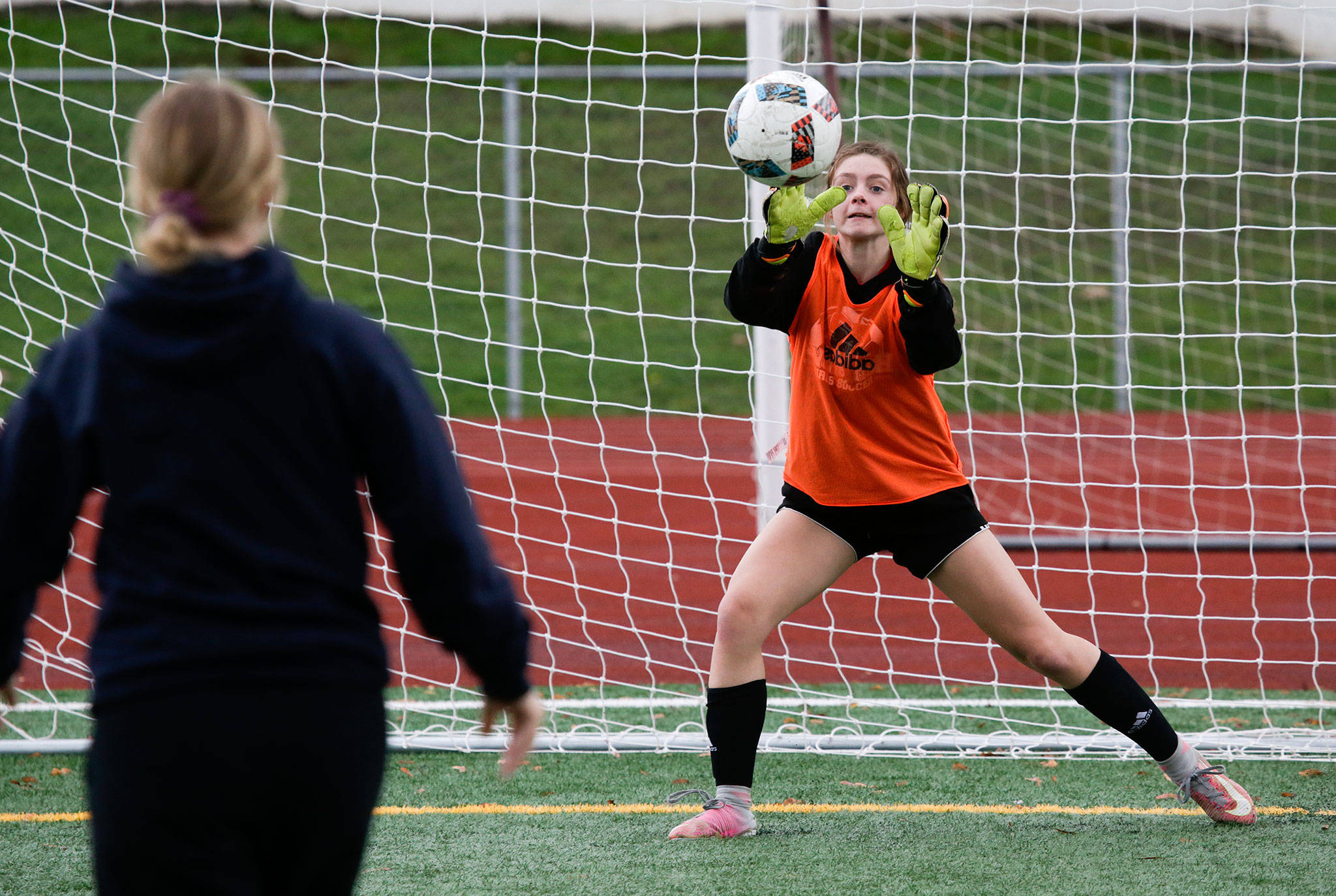 Goalie Cheyenne Rodgers keeps her eyes on the ball as she blocks a kick during shootout drills with the Snohomish High soccer team on Friday, Nov. 2, 2018 in Snohomish. (Andy Bronson / The Herald)