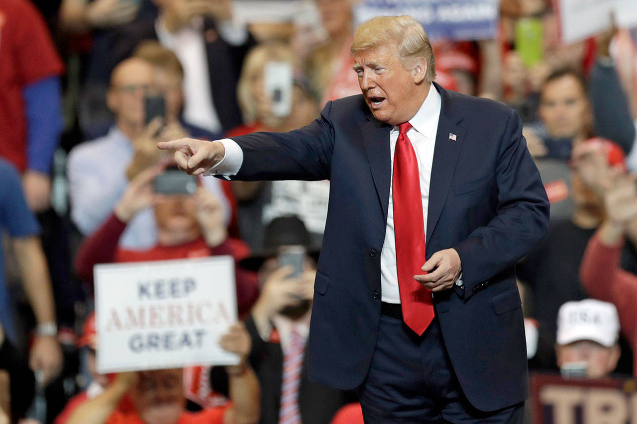 President Donald Trump acknowledges his supporters after speaking at a campaign rally on Monday in Cleveland. (AP Photo/Tony Dejak)