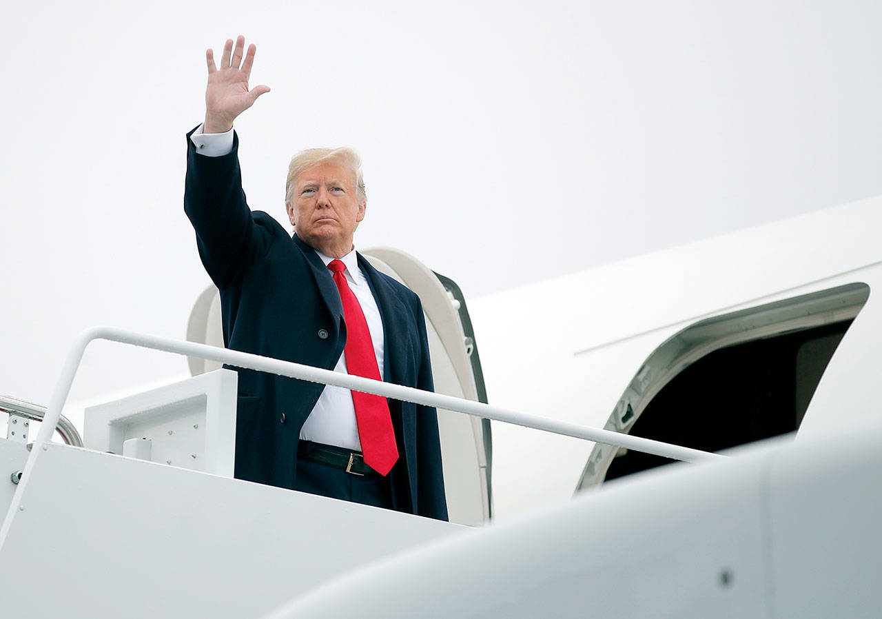 President Donald Trump boards Air Force One on Monday at Andrews Air Force Base, Maryland, en route to a series of campaign rallies. (AP Photo/Carolyn Kaster)