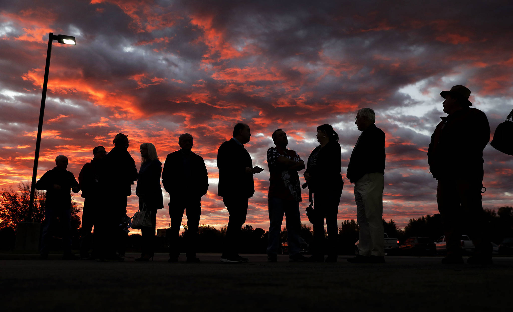 Voters line up to cast their ballots shortly before the polls open in the midterm elections at First Church in Owasso, Oklahoma, on Tuesday. (Mike Simons/Tulsa World via AP)