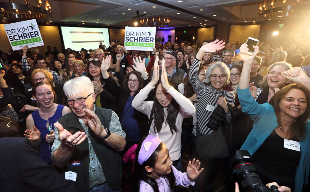 Supporters cheer Congressional candidate Kim Schrier as she addresses the crowd at an election night party for Democrats on Tuesday in Bellevue. (AP Photo/Elaine Thompson)
