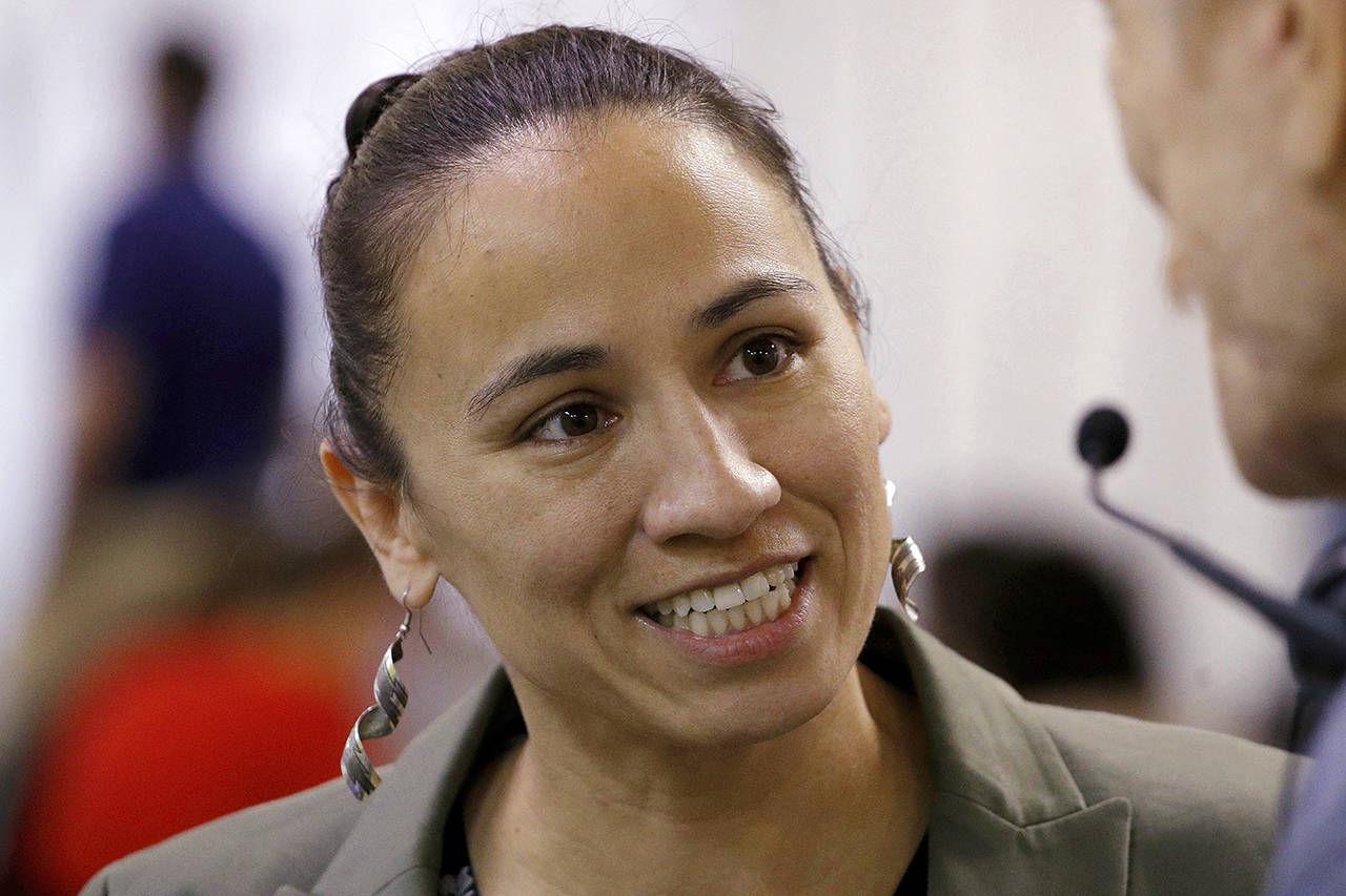 In Kansas, Democrat Sharice Davids beat a GOP incumbent to become the first Native American and gay woman elected to the House. (AP Photo/Charlie Riedel, File)