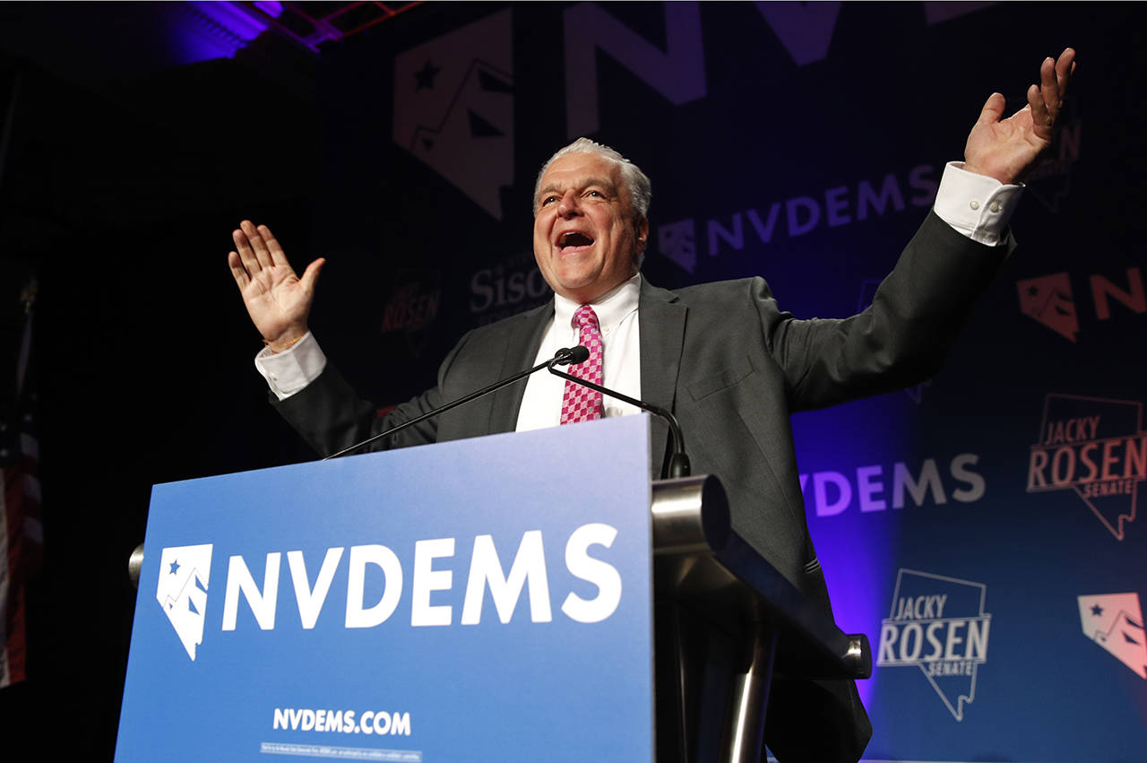 Clark County Commission Chair and Democratic gubernatorial candidate Steve Sisolak greets supporters Wednesday in Las Vegas. (AP Photo/John Locher)