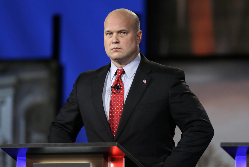 In this 2014 photo, then-Iowa Republican senatorial candidate and former U.S. Attorney Matt Whitaker watches before a live televised debate in Johnston, Iowa. (AP Photo/Charlie Neibergall, File)
