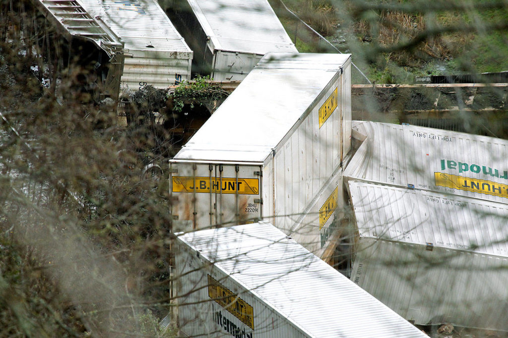 Multiple cars of a freight train were pushed off the tracks due to a mudslide in Everett on Dec. 17, 2012. (Jennifer Buchanan / Herald file)
