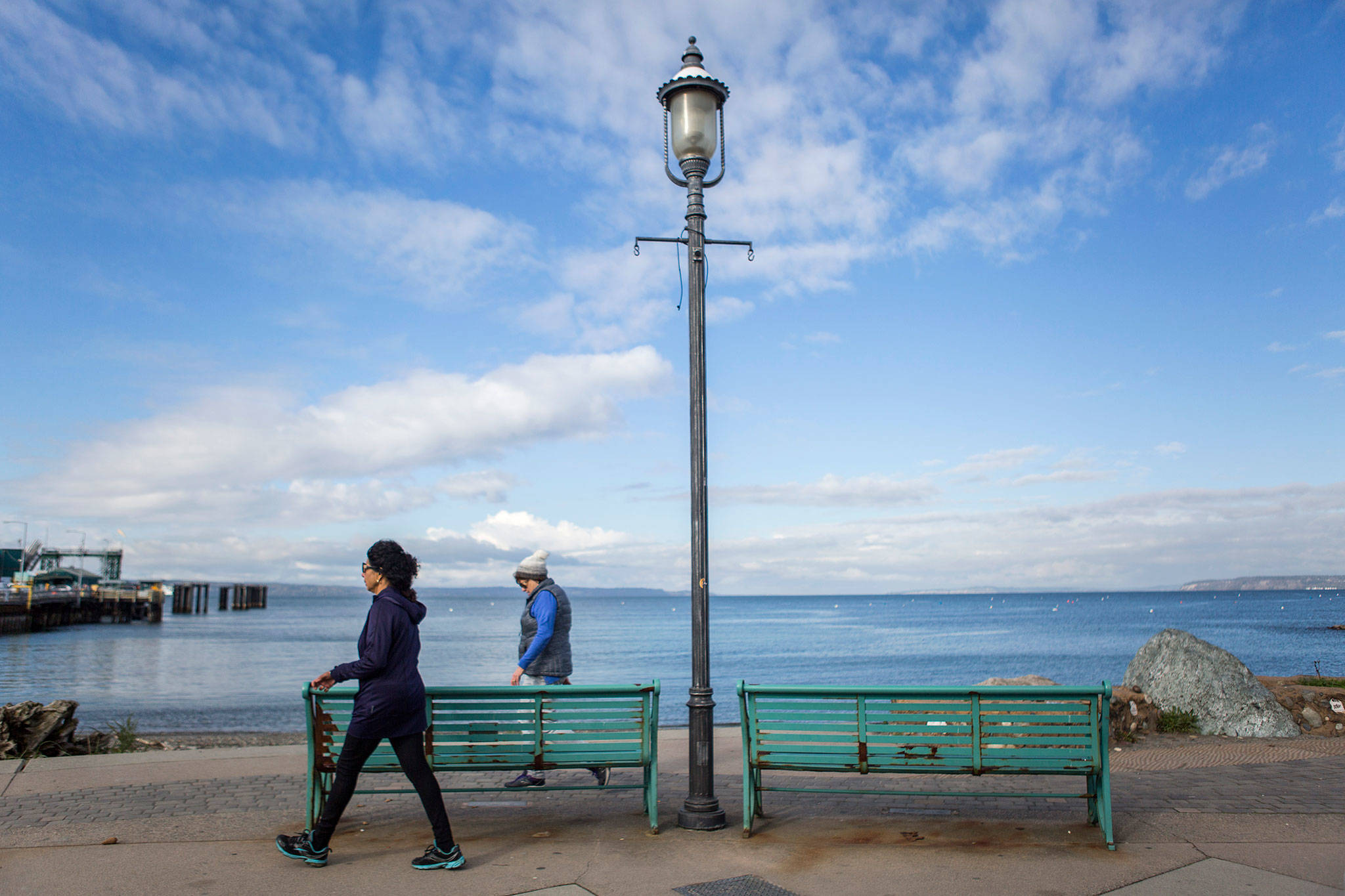 People walk along the main path at Brackett’s Landing in Edmonds. (Olivia Vanni / The Herald)