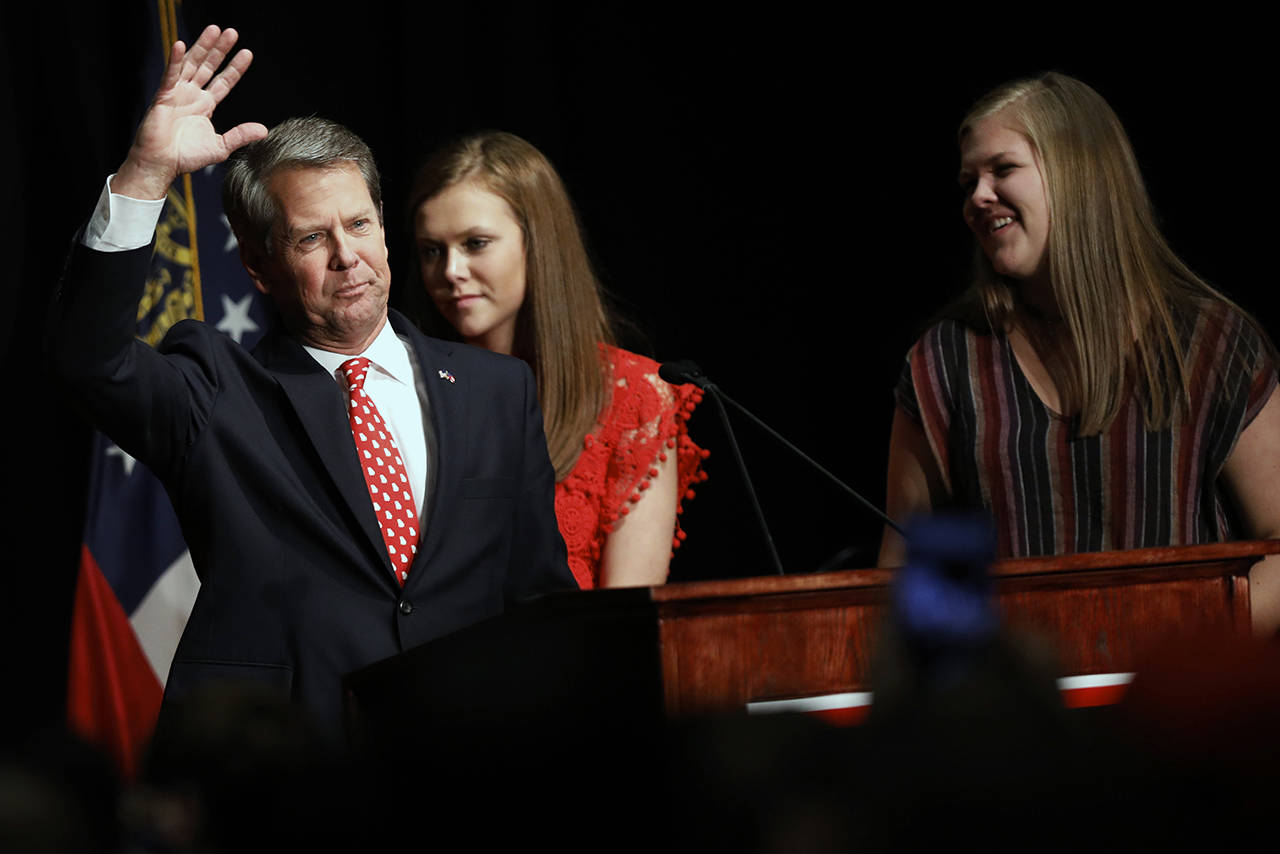 Georgia Republican gubernatorial candidate Brian Kemp acknowledges supporters early Wednesday, after a long election night in Athens, Georgia. (Joshua L. Jones/Athens Banner-Herald via AP)