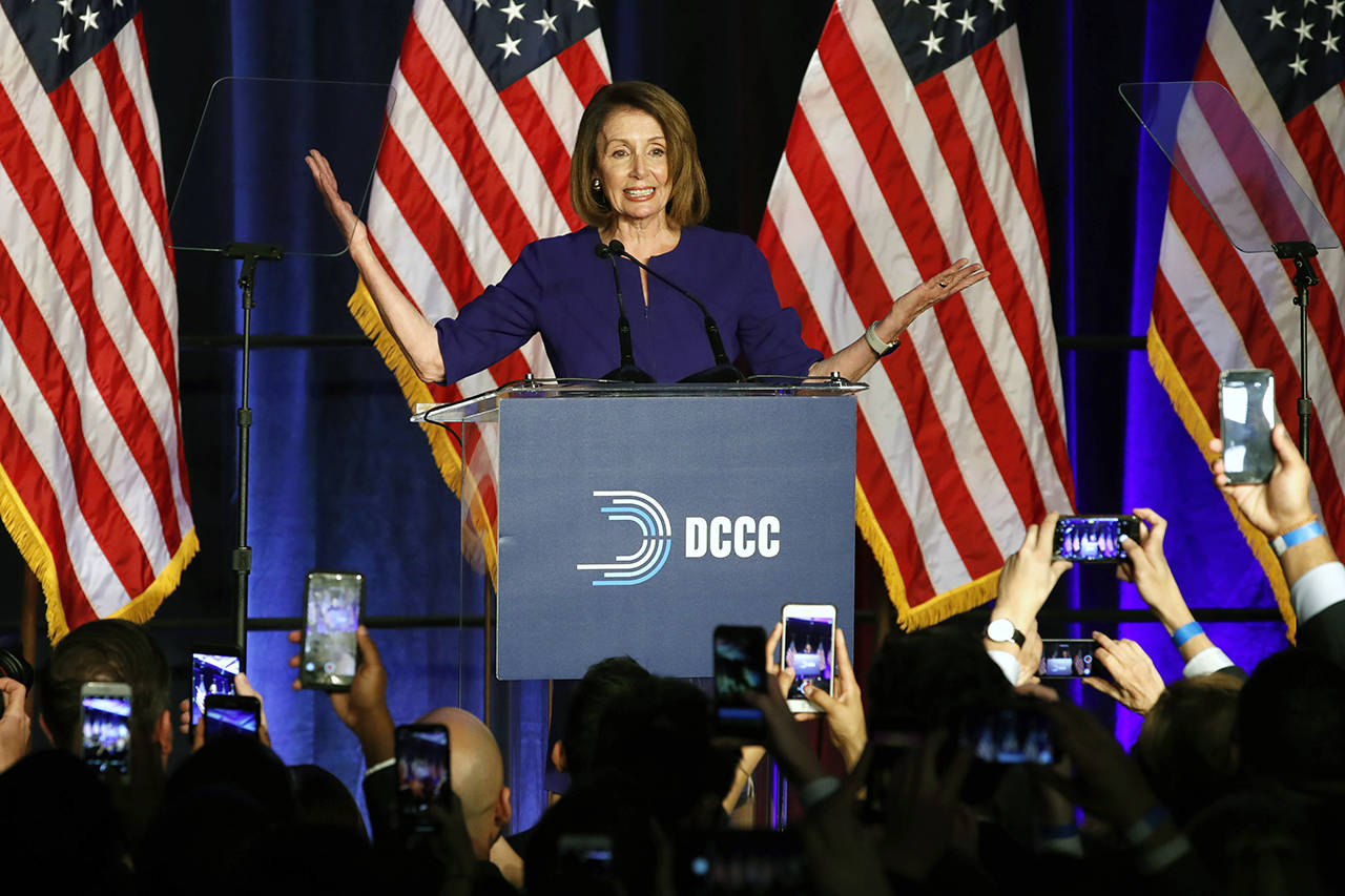 House Minority Leader Nancy Pelosi smiles as she is cheered by a crowd of Democratic supporters during an election night returns event at the Hyatt Regency Hotel on Tuesday in Washington. (AP Photo/Jacquelyn Martin)