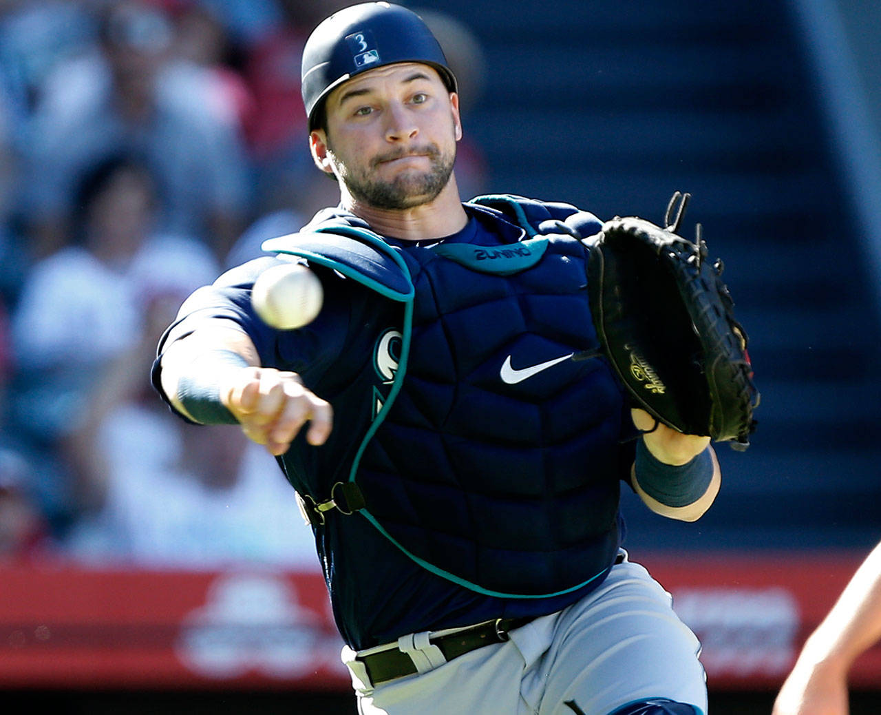 Seattle catcher Mike Zunino throws to first base after Los Angeles Angels designated hitter Shohei Ohtani struck out swinging during the eighth inning of a Sept. 16 game in Anaheim, Calif. (AP Photo/Alex Gallardo)