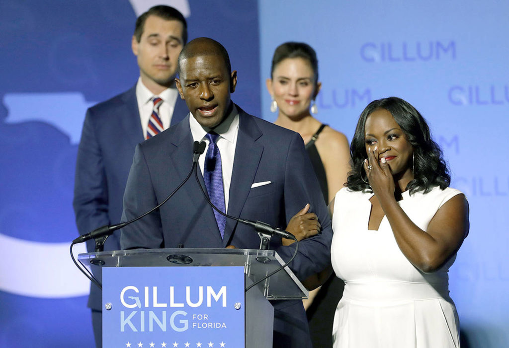 Florida Democratic gubernatorial candidate Andrew Gillum gives his concession speech as he is joined on stage by his wife R. Jai Gillum, right, and running mate Chris King and his wife Kristen Tuesday, Nov. 6, 2018, in Tallahassee, Fla. Gillum lost the Florida governor’s race to Republican Ron DeSantis. (AP Photo/Chris O’Meara)