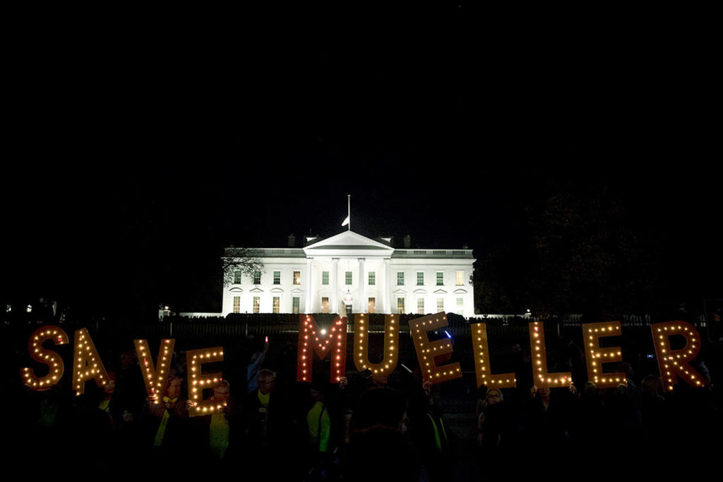 Protesters gather in front of the White House in Washington on Thursday as part of a nationwide “Protect Mueller” campaign demanding that Acting U.S. Attorney General Matthew Whitaker recuse himself from overseeing the ongoing special counsel investigation. (AP Photo/Andrew Harnik)
