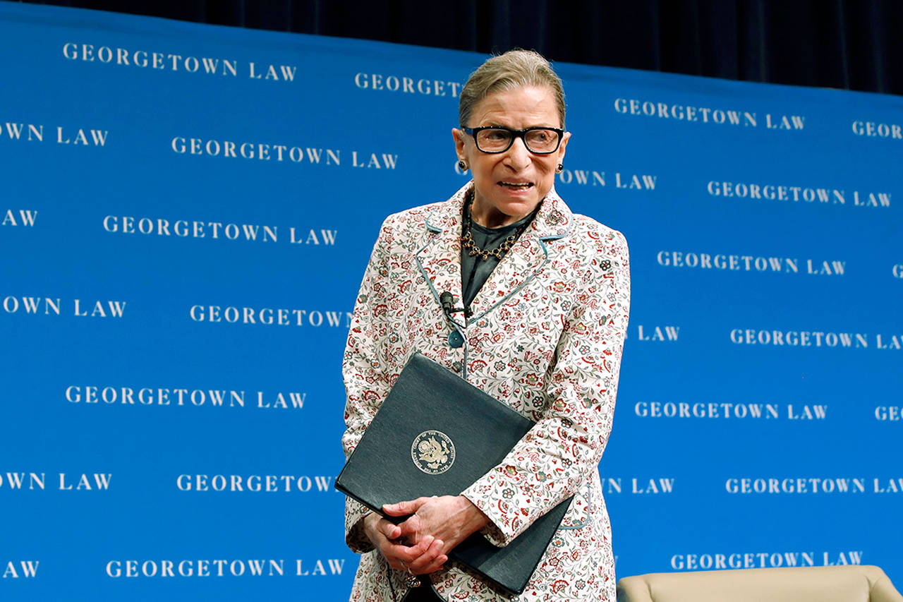 In this Sept. 26 photo, Supreme Court Justice Ruth Bader Ginsburg leaves the stage after speaking to first-year students at Georgetown Law in Washington. (AP Photo/Jacquelyn Martin, File)