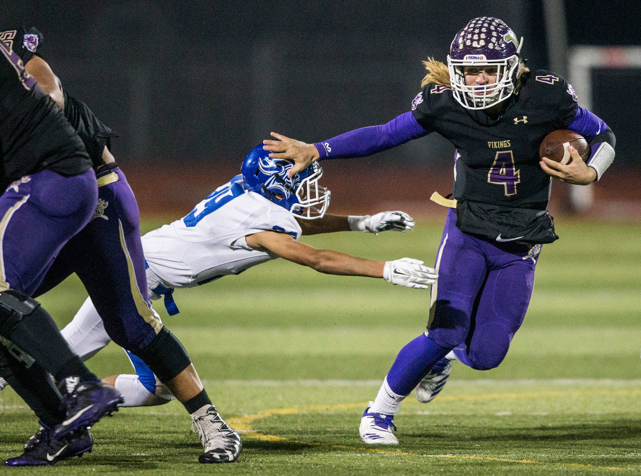 Lake Stevens quarterback Tre Long escapes a tackle during a 4A state playoff game against Curtis on Nov. 9 in Lake Stevens. (Olivia Vanni / The Herald)