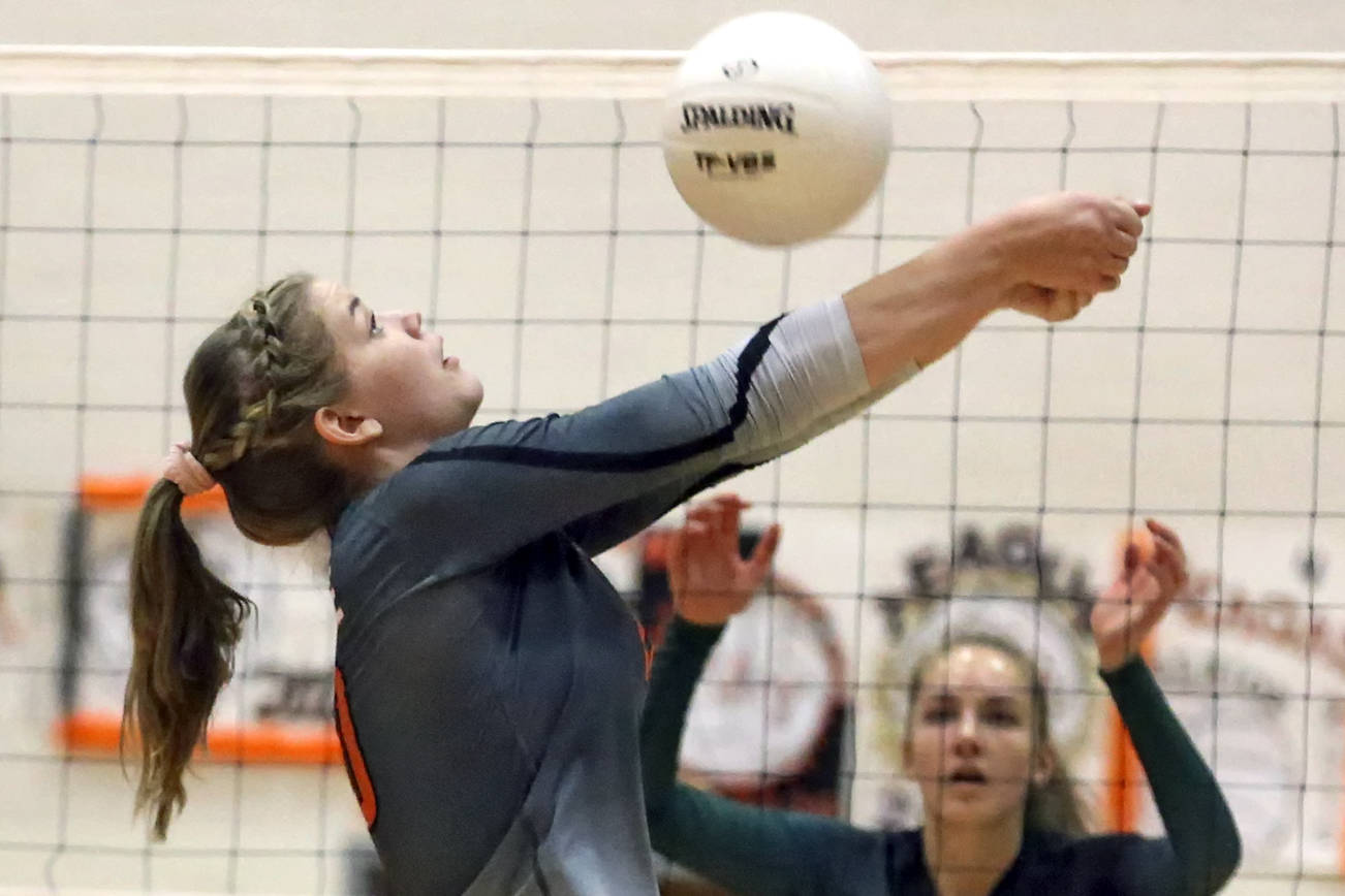 Monroe’s Tatum McGovern volleys against Jackson Tuesday night at Monroe High School on October 9, 2018. (Kevin Clark / The Herald)