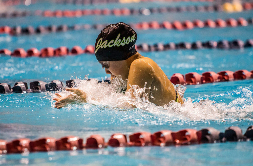 Jackson’s Mia Chang swims the breaststroke leg of the 200-yard medley relay during the 4A state swimming and diving championships on Nov. 10, 2018, in Federal Way. (Olivia Vanni / The Herald)
