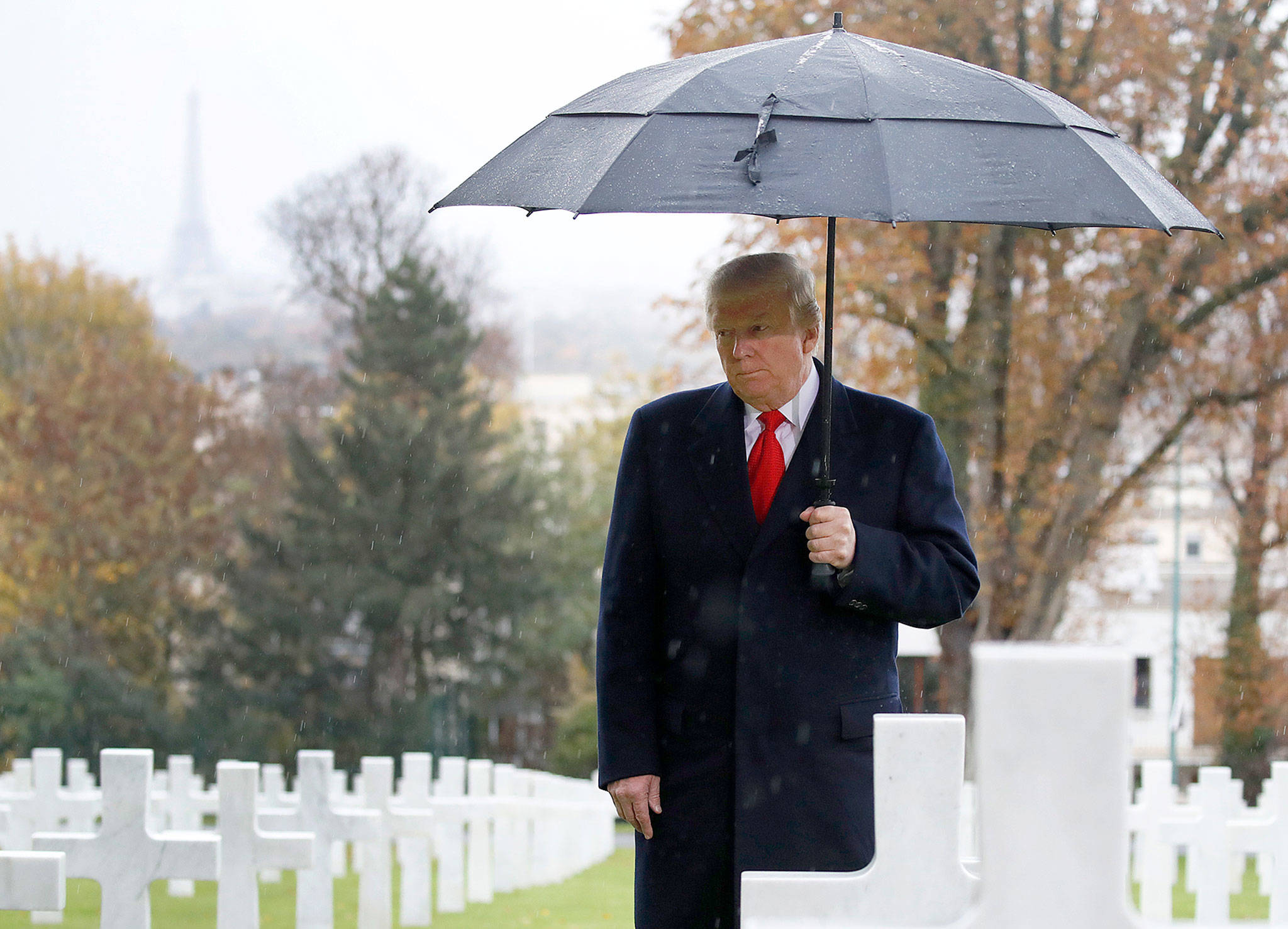 President Donald Trump stands amidst the headstones during a ceremony on Sunday at Suresnes American Cemetery near Paris. (AP Photo/Jacquelyn Martin)