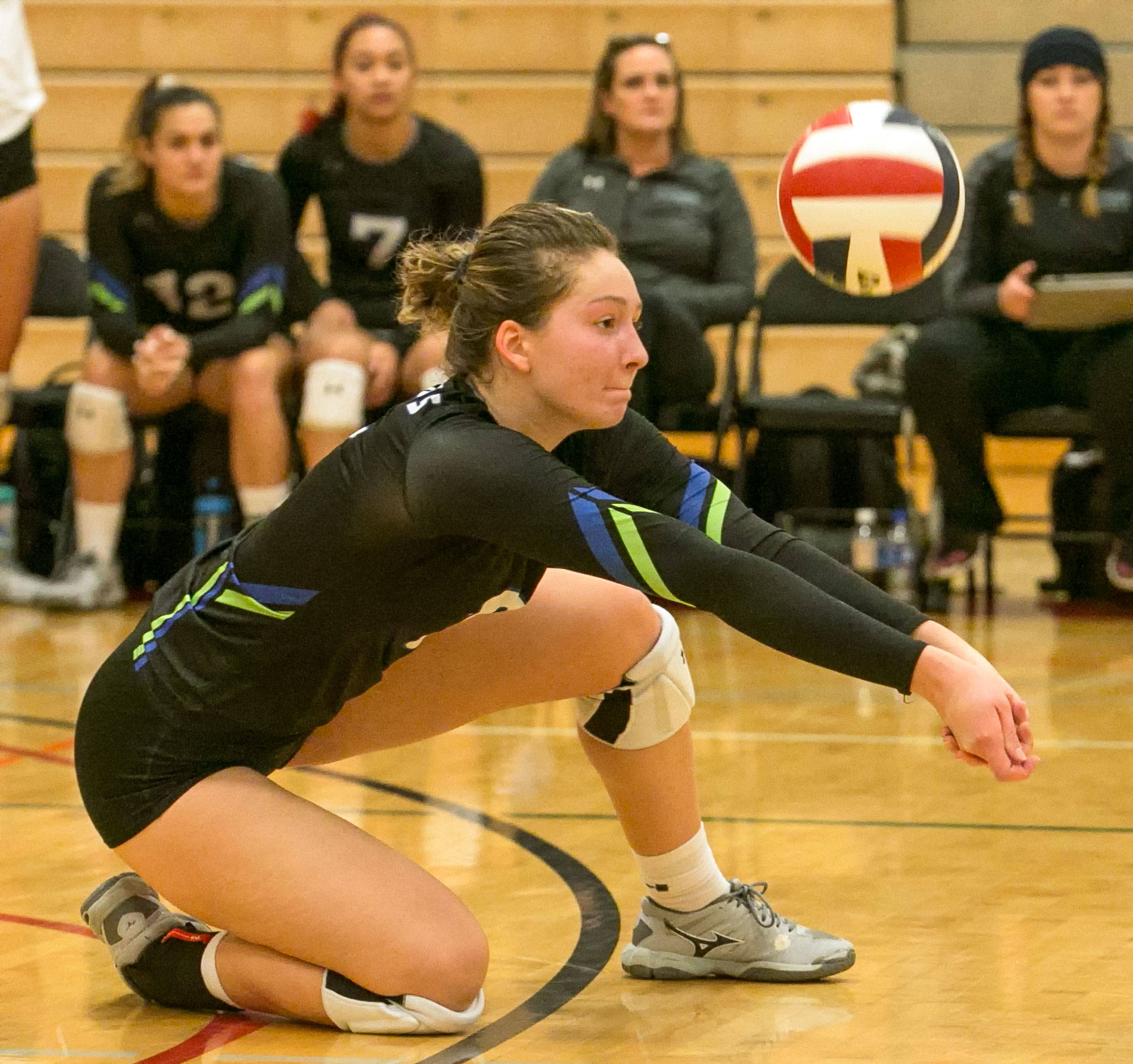 Edmonds Community College’s Michelle Dmitruk, a Cascade High School alumna, digs a ball during the Tritons’ Oct. 31 match at Skagit Valley College in Mount Vernon. (Kevin Clark / The Herald)