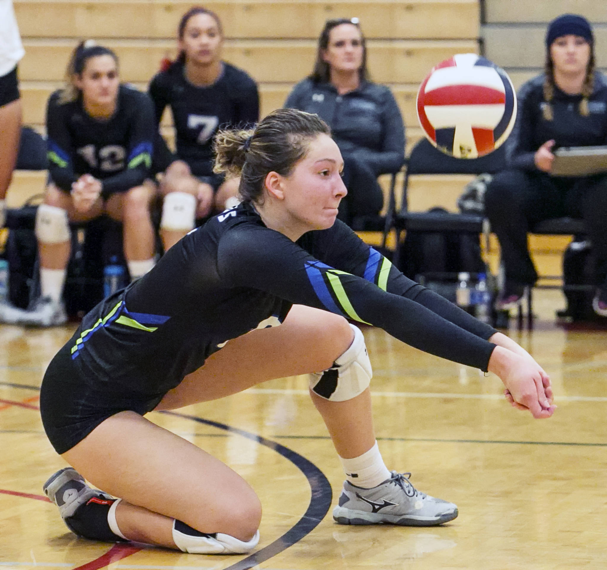 Edmonds’ Michelle Dmitruk makes a dig against the Skagit Valley College team in Mt. Vernon on Oct. 31. (Kevin Clark / The Herald)