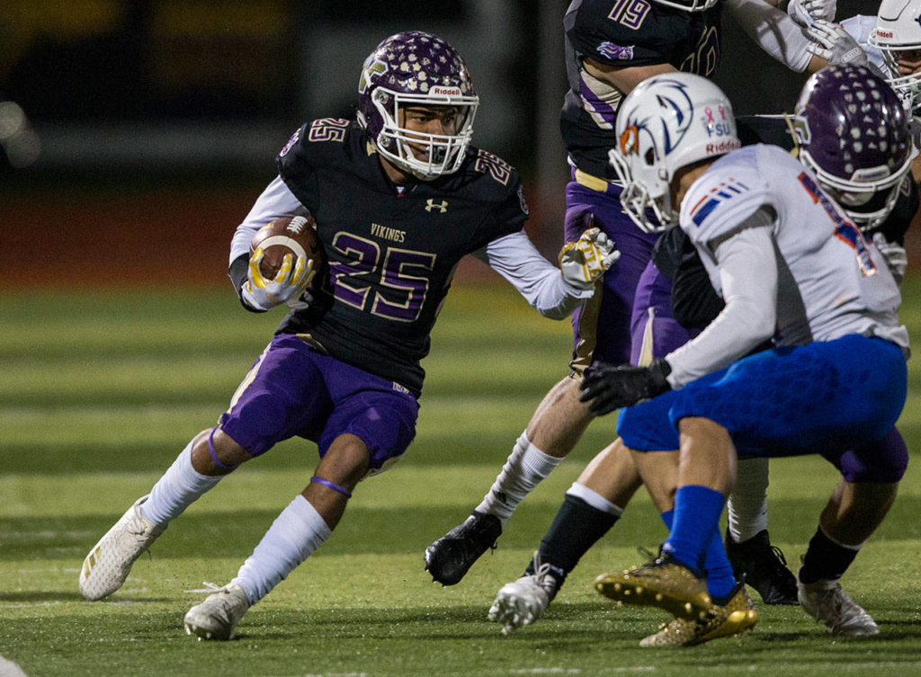 Lake Stevens’ Kasen Kinchen runs the ball during a 4A state quarterfinal game against Graham-Kapowsin on Nov. 17, 2018, in Lake Stevens. (Olivia Vanni / The Herald)
