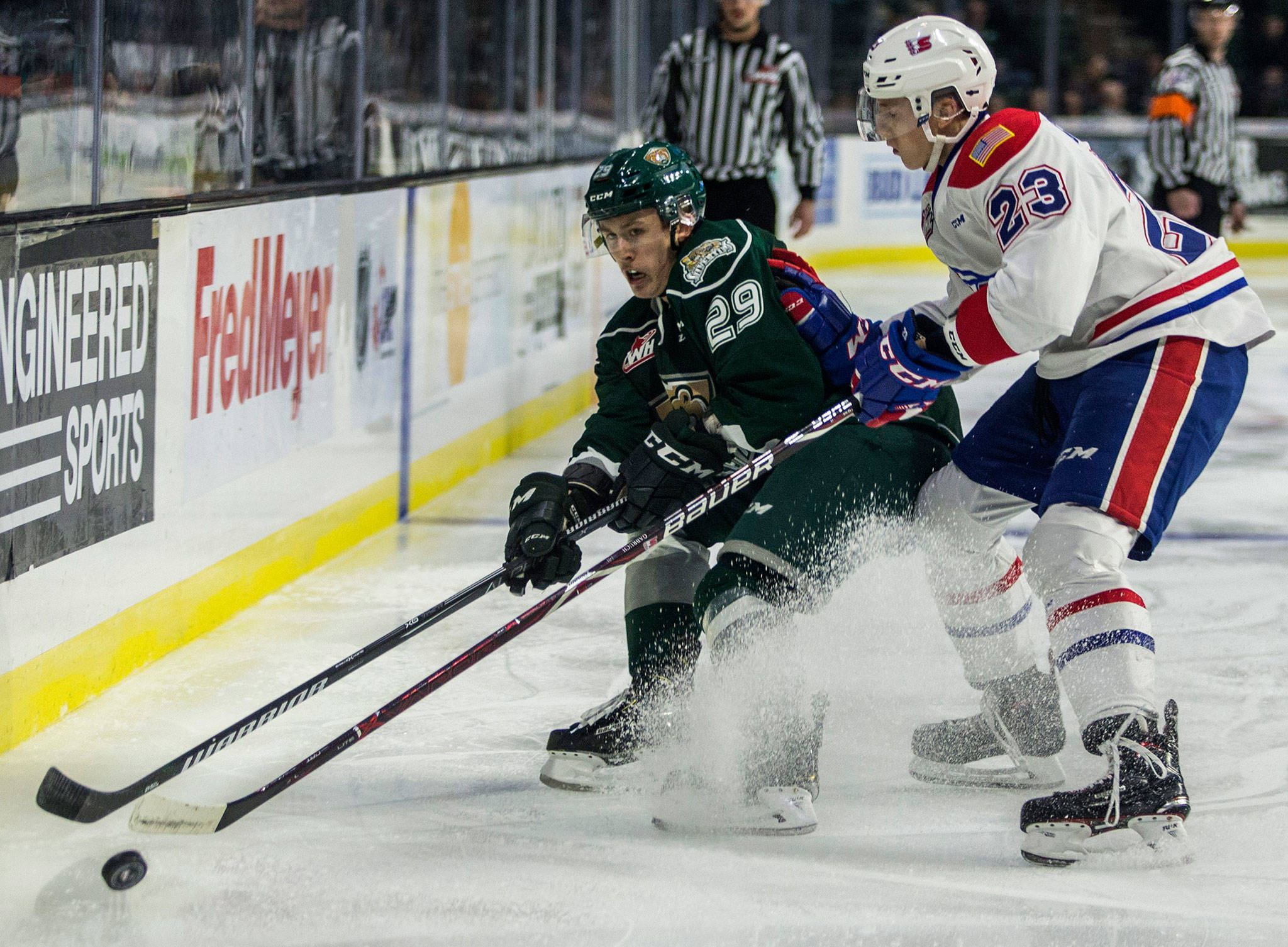 Silvertips’ Wyatte Wylie fights for the puck during the game against the Spokane Chiefs on Sunday in Everett. (Olivia Vanni / The Herald)