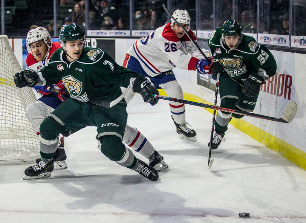 Silvertips’ Martin Fasko-Rudas and Gage Conclaves fight for the puck during the game against the Spokane Chiefs on Nov. 18, in Everett. (Olivia Vanni / The Herald)
