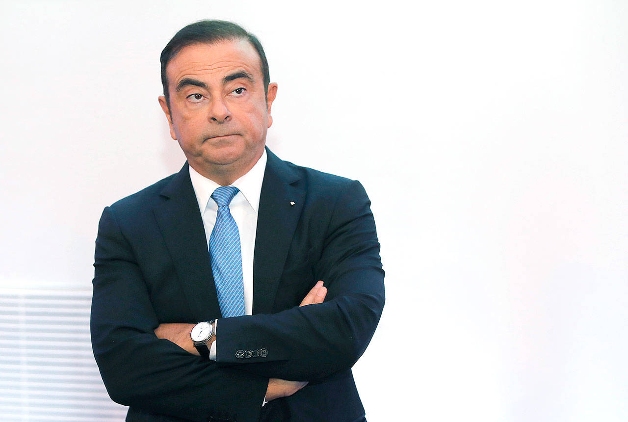 Renault and Nissan Motor Co.’s chairman, Carlos Ghosn, listens during a media conference outside Paris, France, in 2017. (AP Photo/Michel Euler, File)