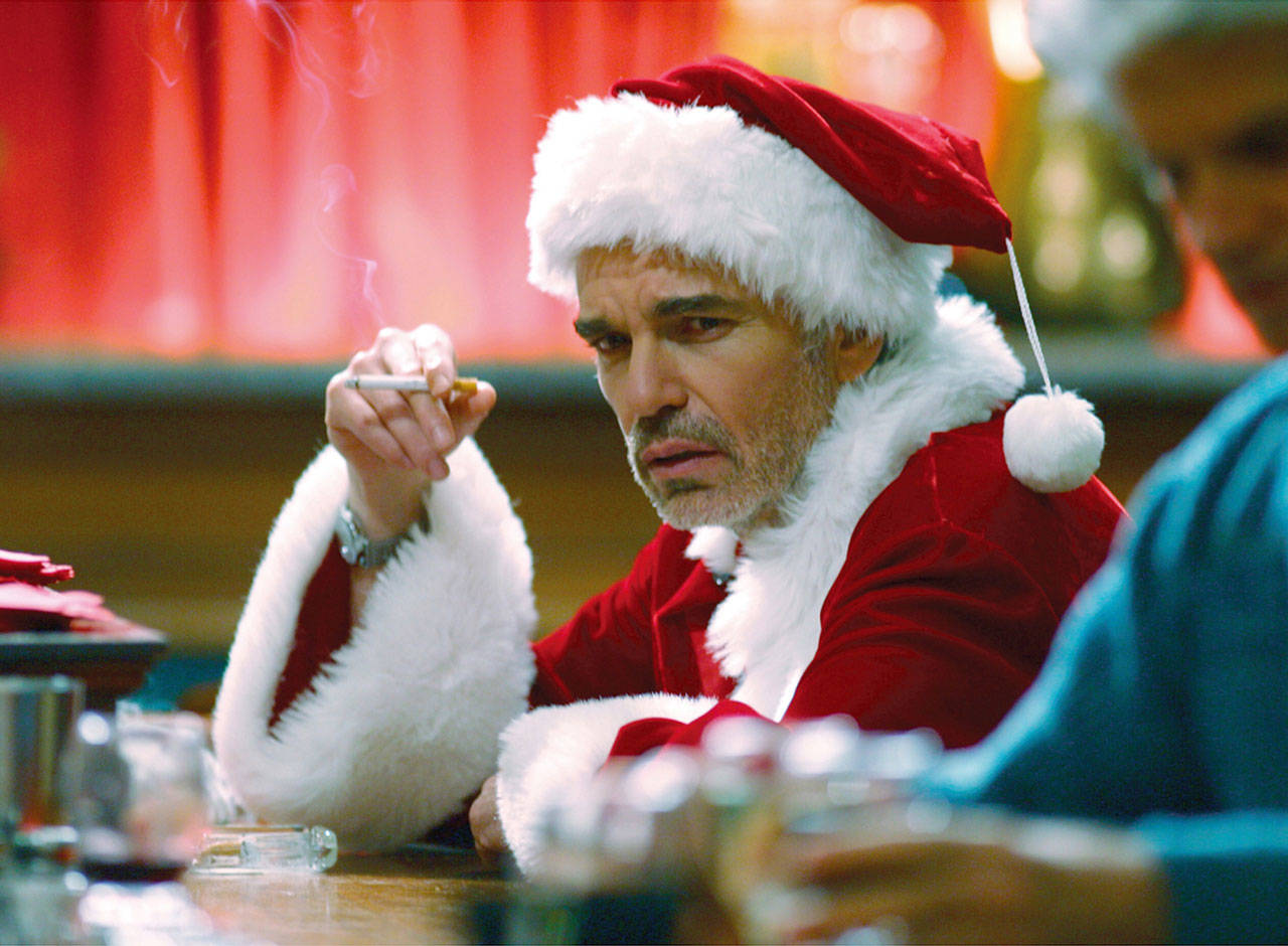 Billy Bob Thornton plays a gutter-mouthed drunk who poses as a mall Santa for a con job in the 2003 movie “Bad Santa.” (Columbia TriStar)