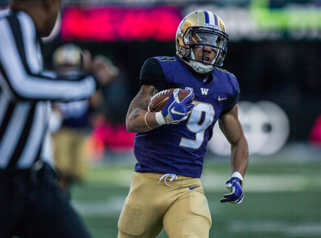 Washington’s Myles Gaskin runs the ball down the sideline during the game against Oregon State on Saturday, Nov. 17, 2018 in Seattle, Wa. (Olivia Vanni / The Herald)
