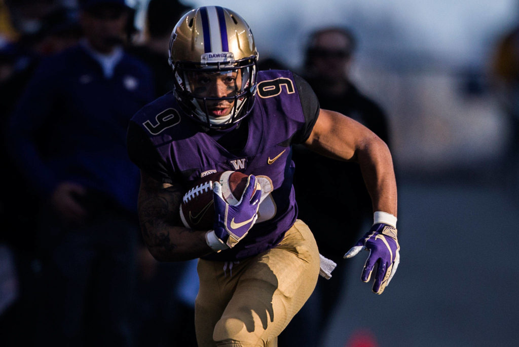 Washington’s Myles Gaskin runs the ball down the sideline during the game against Oregon State on Saturday, Nov. 17, 2018 in Seattle, Wa. (Olivia Vanni / The Herald)
