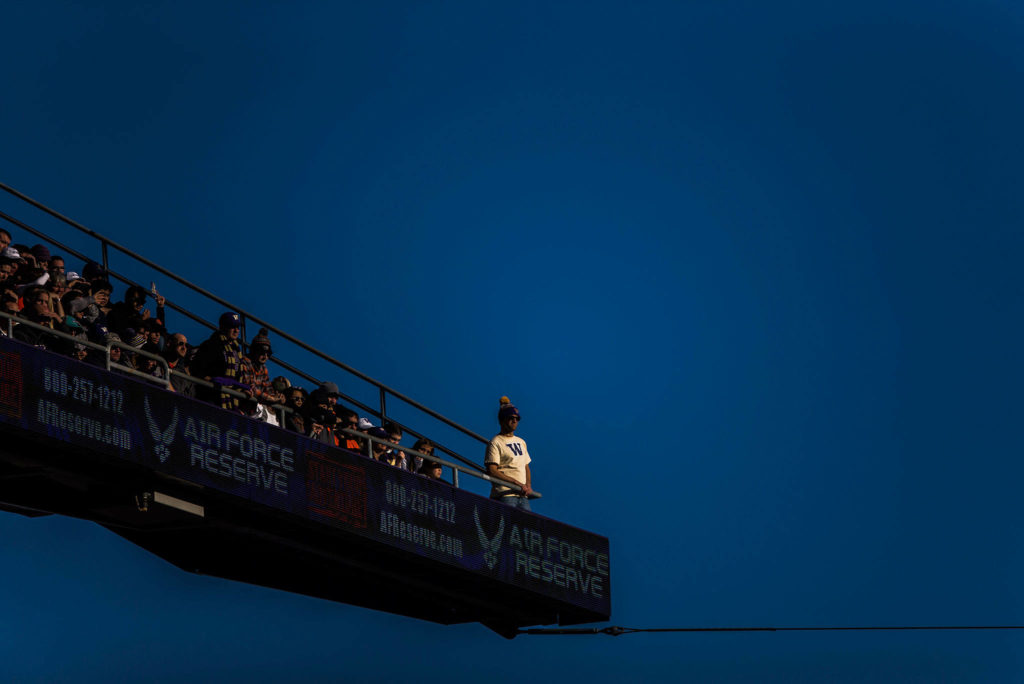 A Washington fan stands on the upper level of the stadium during the game against Oregon State on Saturday, Nov. 17, 2018 in Seattle, Wa. (Olivia Vanni / The Herald)
