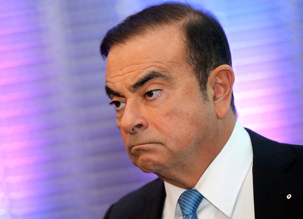 Renault Group CEO Carlos Ghosn listens during a media conference at La Defense business district, outside Paris Oct. 6, 2017. The arrest of Nissan Motor Co.’s chairman Ghosn on charges he underreported his income and misused company funds caused the company’s shares to tumble and shocked many in Japan who view him as something of a hero. (AP Photo/Michel Euler, File)