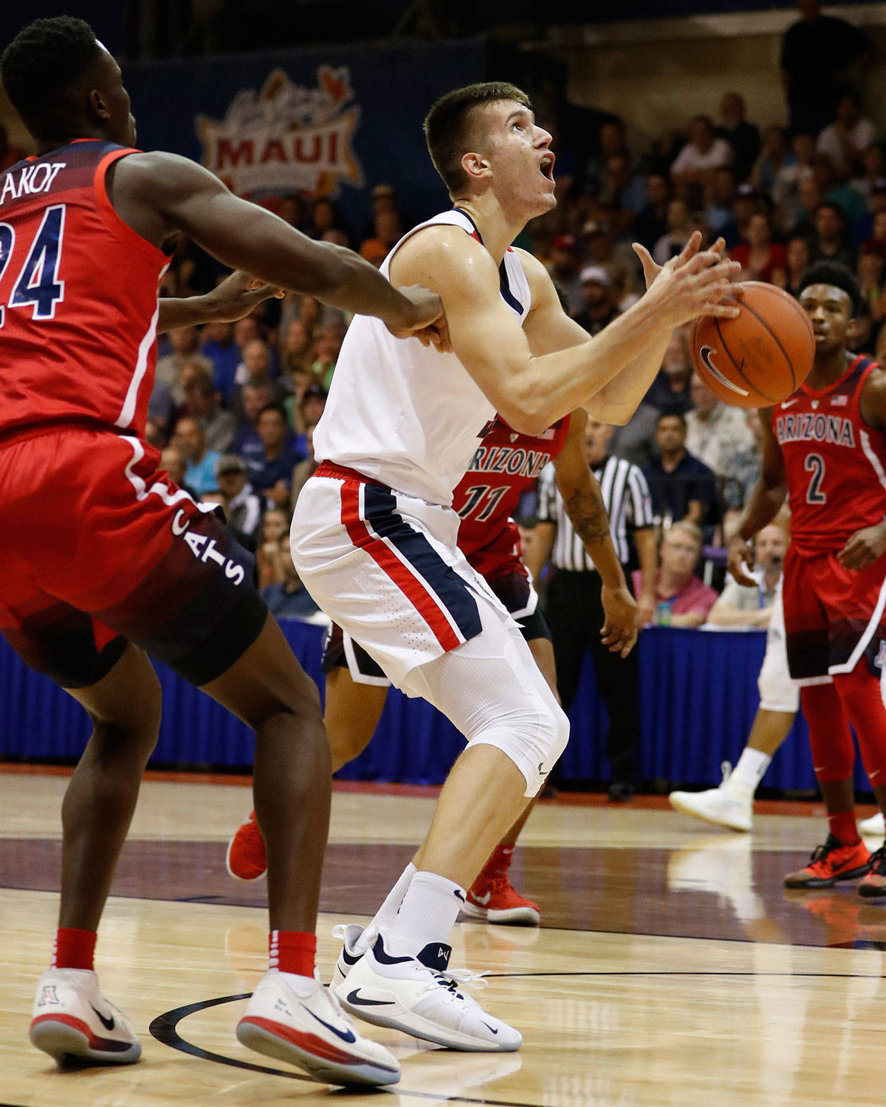 Gonzaga forward Filip Petrusev drops the ball under the basket during the first half of a Tuesday game in Lahaina, Hawaii. (AP Photo/Marco Garcia)