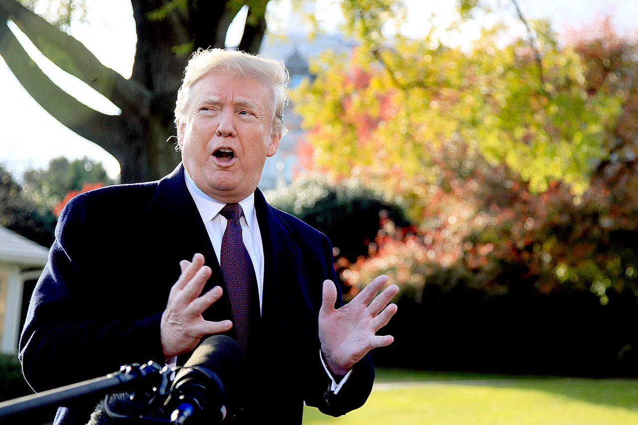 President Donald Trump speaks to reporters before leaving the White House in Washington on Tuesday to travel to Florida, where he is spending Thanksgiving at Mar-a-Lago. (AP Photo/Manuel Balce Ceneta)